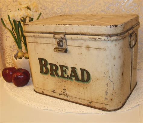 old fashioned metal bread box with bread on the front|old fashioned bread box reproduction.